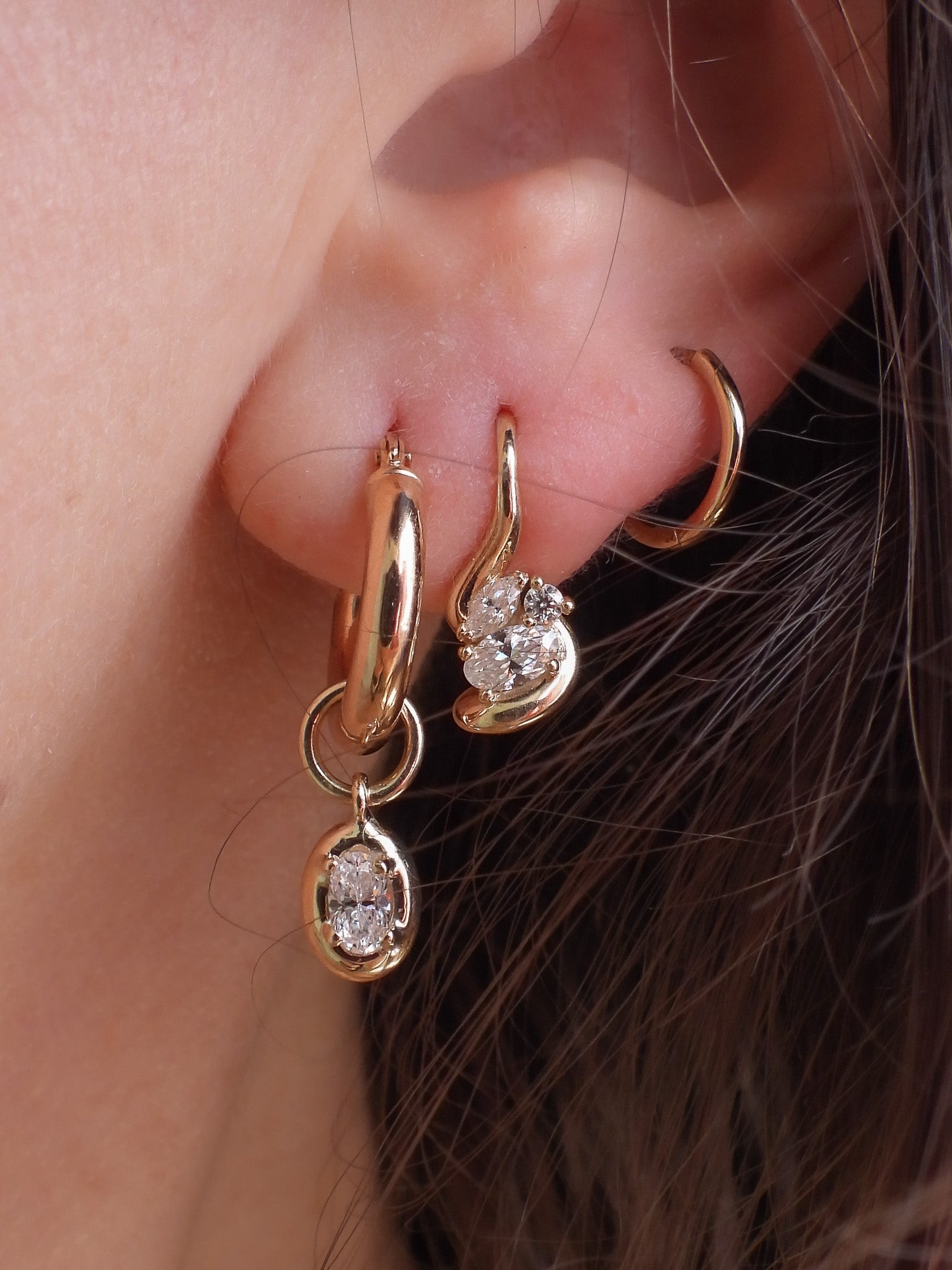 Gold stacking earrings with diamonds