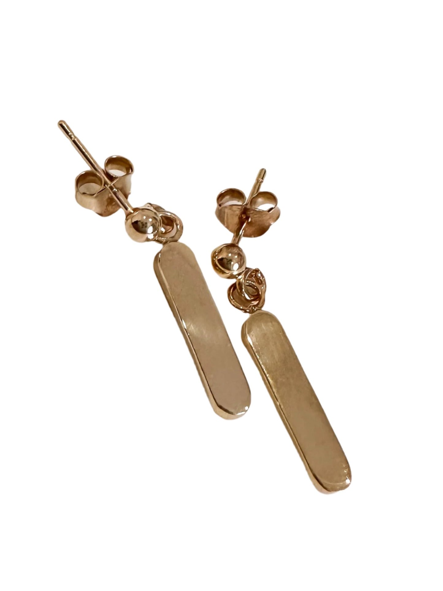 Minimalist dangling earrings. Handmade from 925 sterling silver, these earrings possess a substantial weight that enhances the graceful swing of the product. The weightiness adds to their allure, making them a delightful jewellery choice for any occasion.