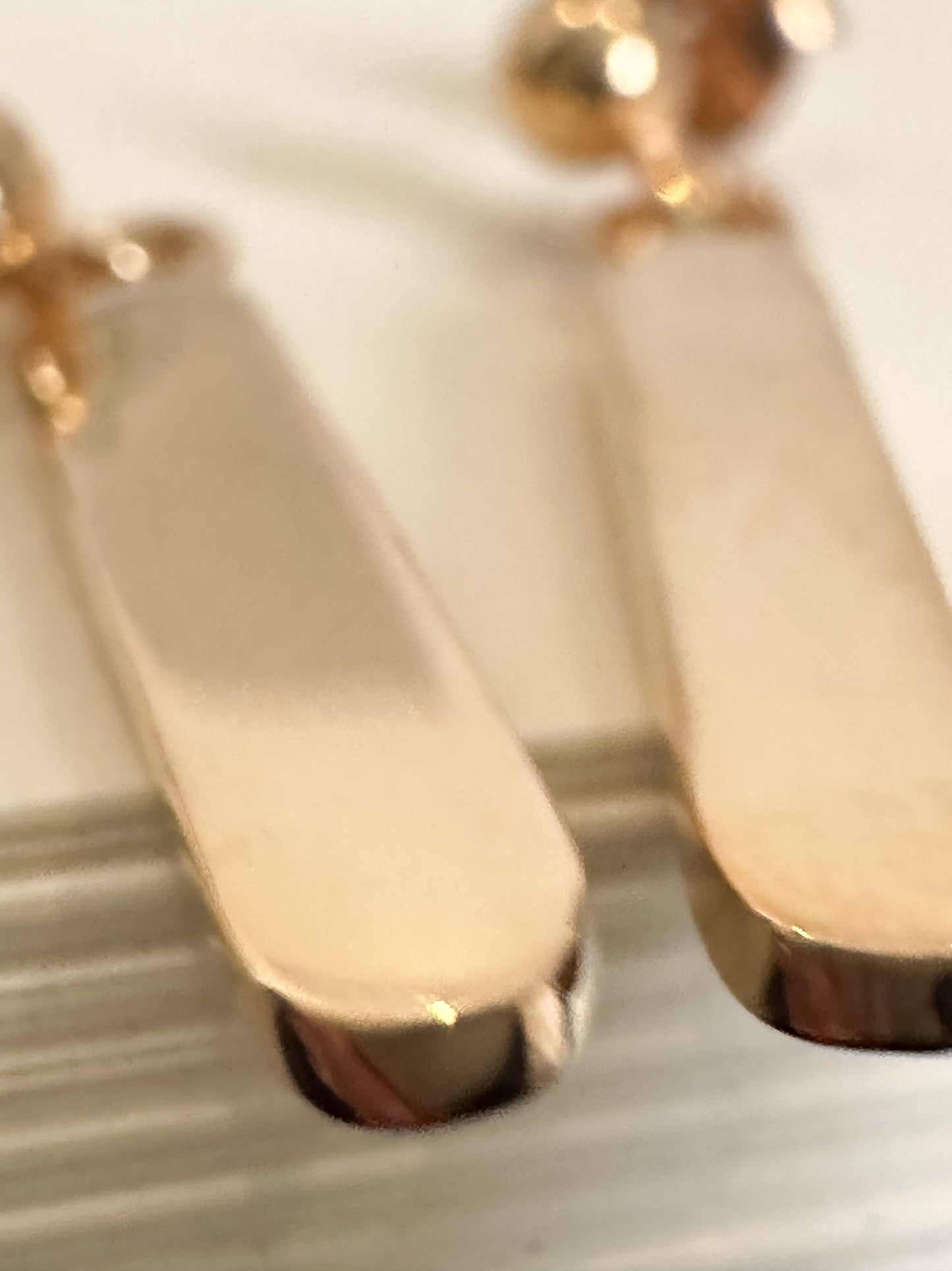 Minimalist dangling earrings. Handmade from 925 sterling silver, these earrings possess a substantial weight that enhances the graceful swing of the product. The weightiness adds to their allure, making them a delightful jewellery choice for any occasion.