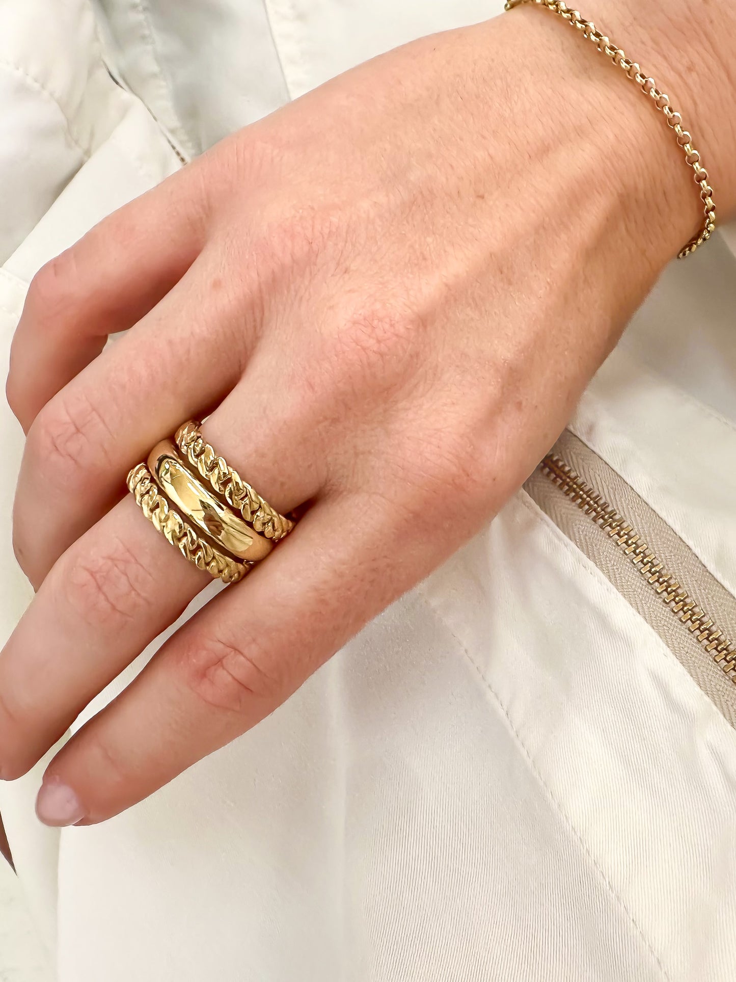 The ideal plain-band ring. Key Features: Versatile Design: This half round ring is a chameleon of style, ready to stand out solo or layer up. Its chunky, weighty feel adds substance to your ensemble. Width & weight: 4mm , average 7g (9ct) & 9g (18ct) Precious Metal Options: Available in solid 9ct or 18ct yellow gold, it serves as an ideal wedding band or addition to your everyday stack.