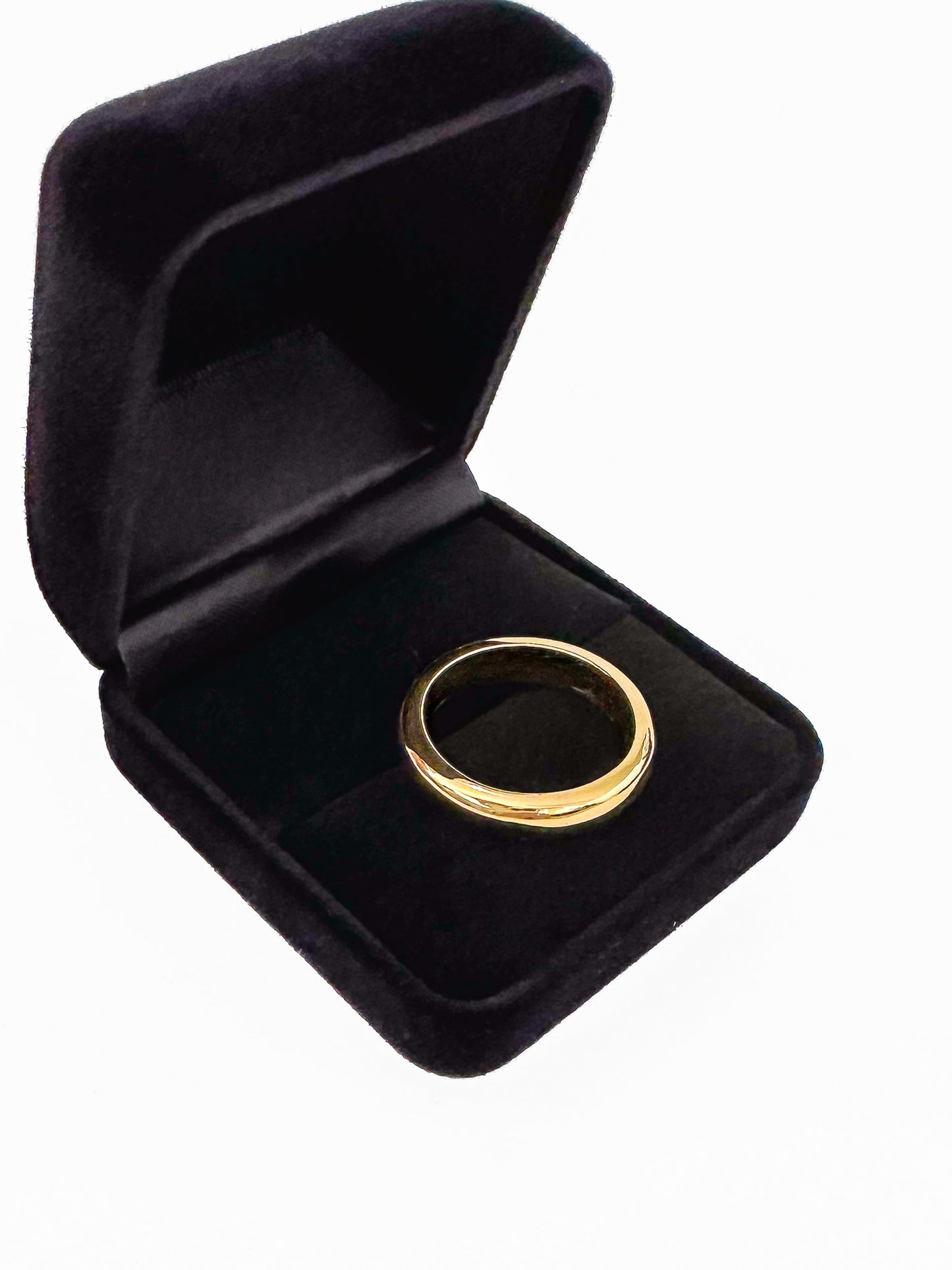 The ideal plain-band ring. Key Features: Versatile Design: This half round ring is a chameleon of style, ready to stand out solo or layer up. Its chunky, weighty feel adds substance to your ensemble. Width & weight: 4mm , average 7g (9ct) & 9g (18ct) Precious Metal Options: Available in solid 9ct or 18ct yellow gold, it serves as an ideal wedding band or addition to your everyday stack.