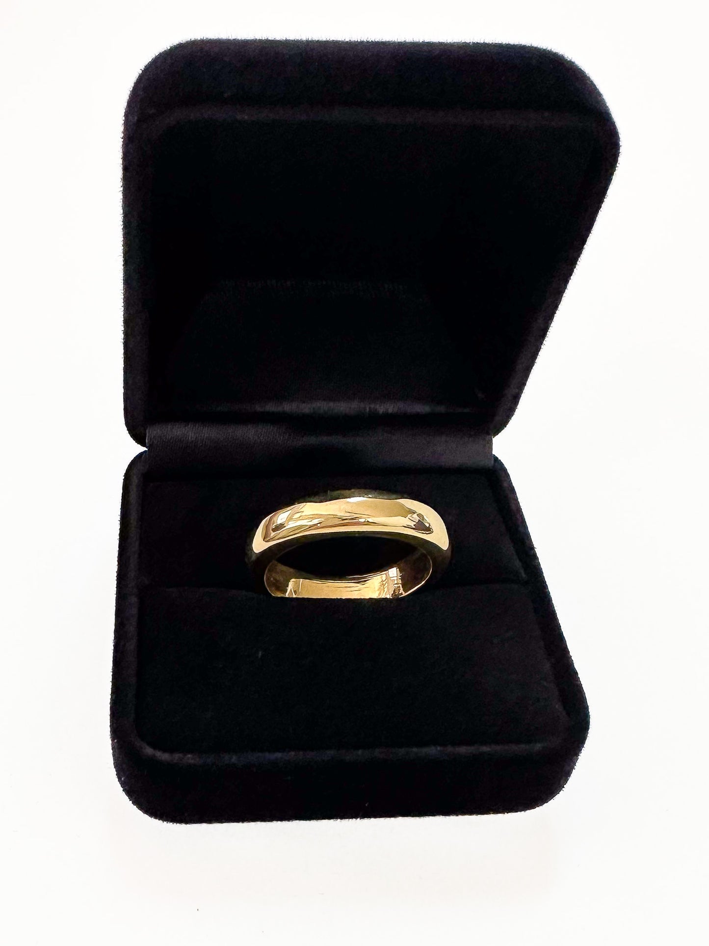 The ideal plain-band ring.  Key Features:  Versatile Design: This half round ring is a chameleon of style, ready to stand out solo or layer up. Its chunky, weighty feel adds substance to your ensemble. Width & weight: 4mm , average 7g (9ct) & 9g (18ct) Precious Metal Options: Available in solid 9ct or 18ct yellow gold, it serves as an ideal wedding band or addition to your everyday stack. 