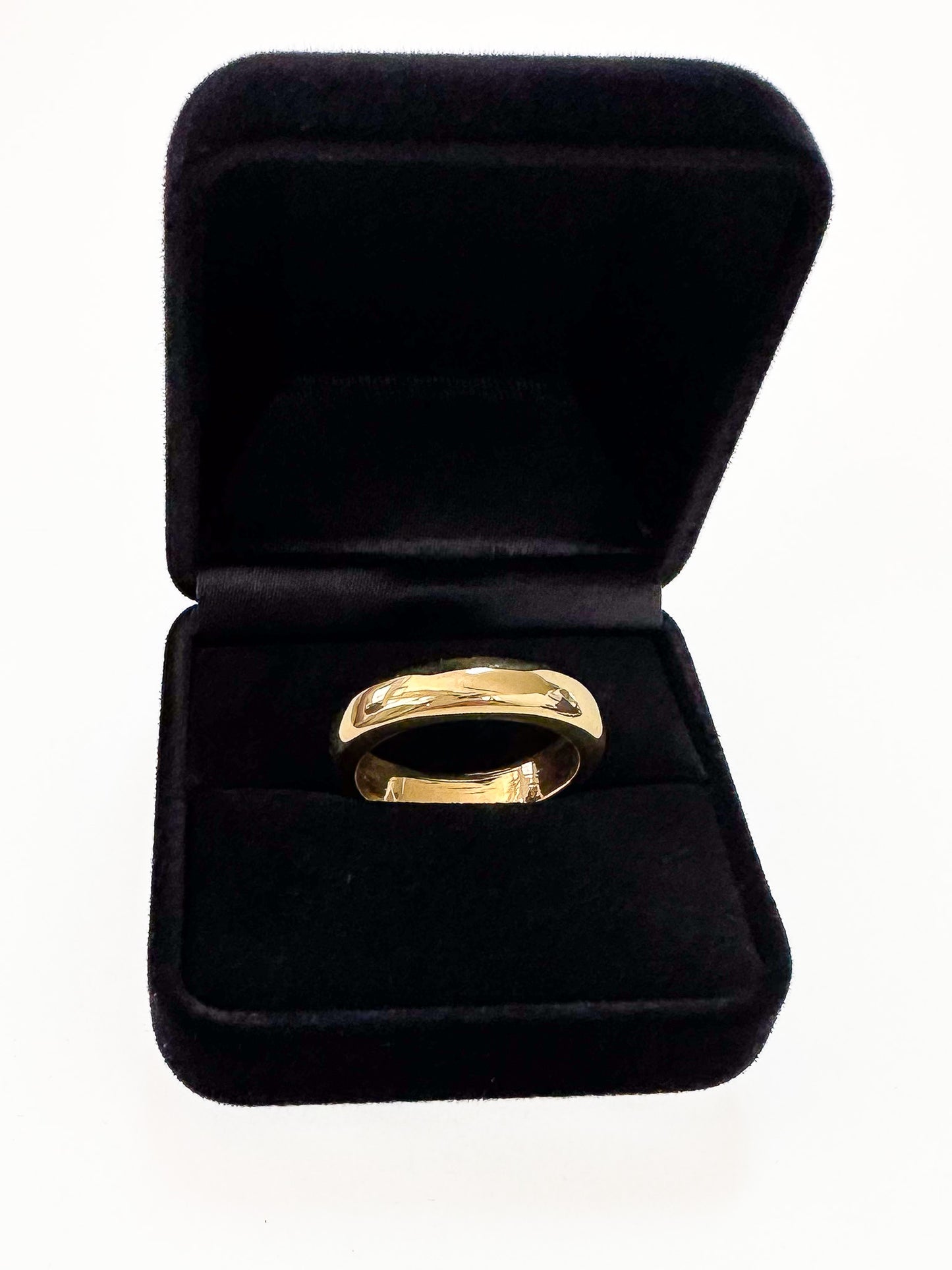 The ideal plain-band ring. Key Features: Versatile Design: This half round ring is a chameleon of style, ready to stand out solo or layer up. Its chunky, weighty feel adds substance to your ensemble. Width & weight: 4mm , average 7g (9ct) & 9g (18ct) Precious Metal Options: Available in solid 9ct or 18ct yellow gold, it serves as an ideal wedding band or addition to your everyday stack.