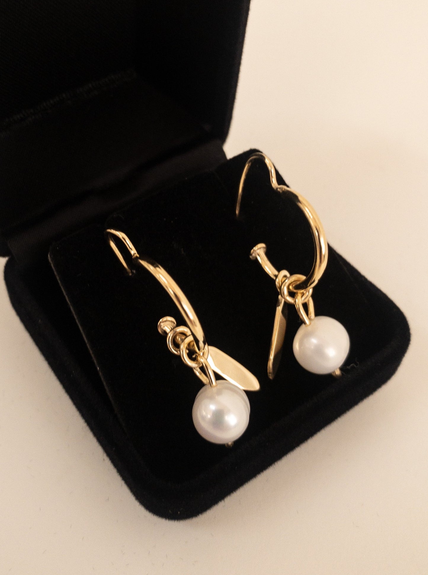 hoop earrings with charms.Sterling Silver: Crafted from high-quality 925 sterling silver. 8mm A-Grade Round Freshwater Pearl: The centre piece of these hoops, adding an element of timeless elegance.