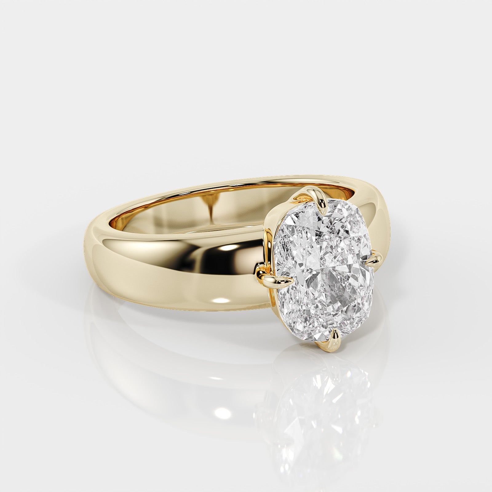 Gold ring with a cushion-shaped diamond on a white background