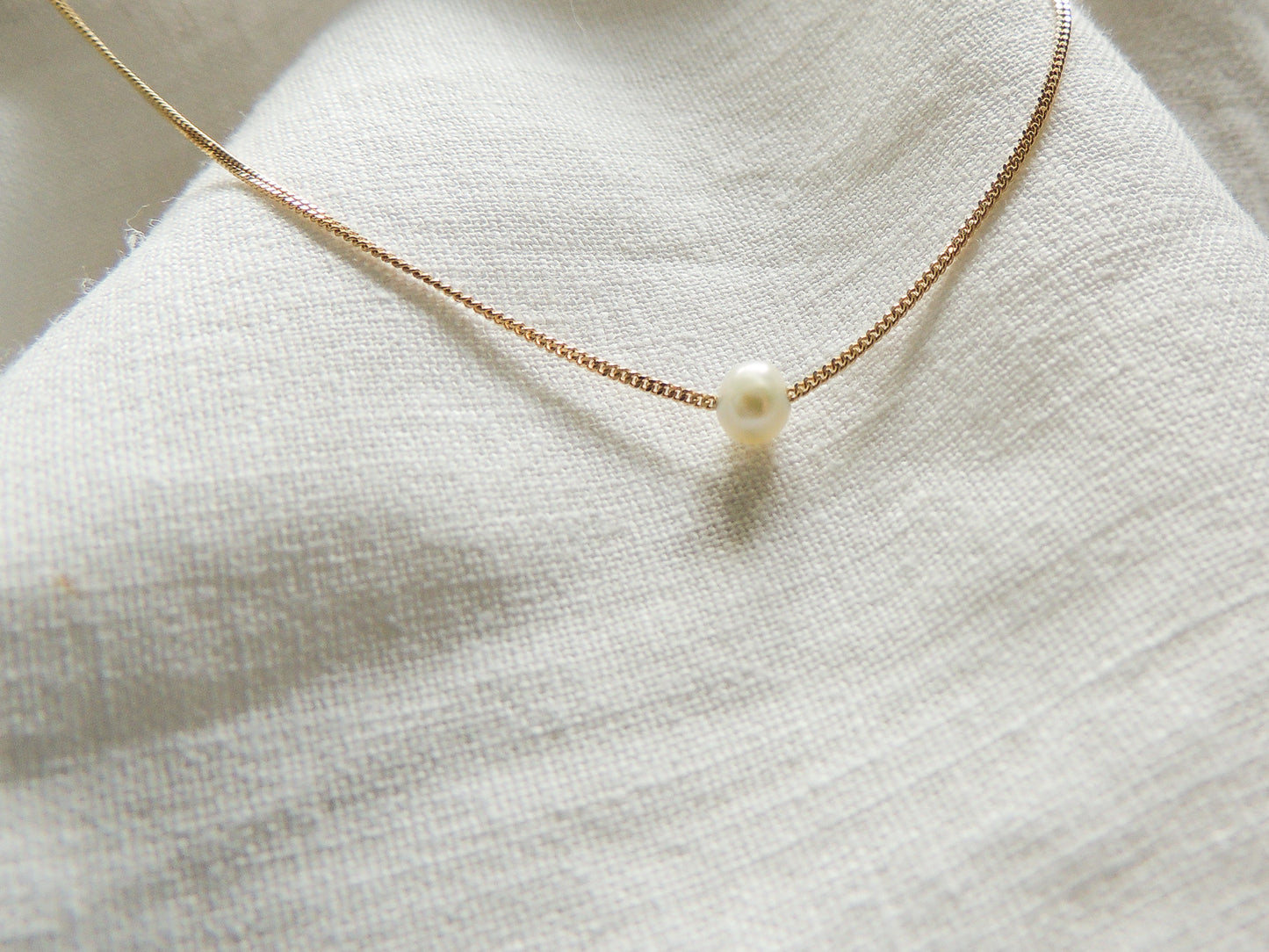 solid gold chain with a freshwater pearl. dainty necklace