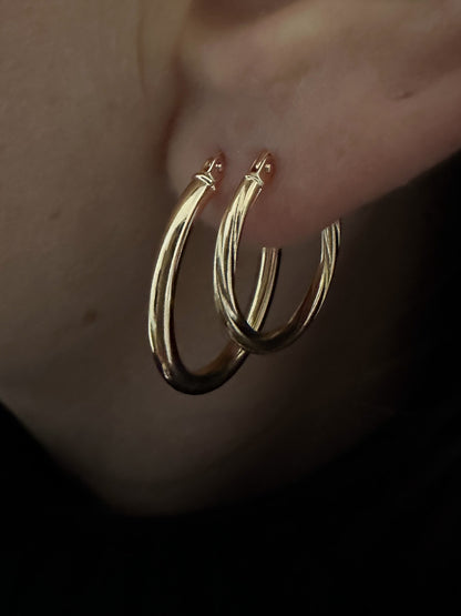 multiple layered hoop earrings in gold