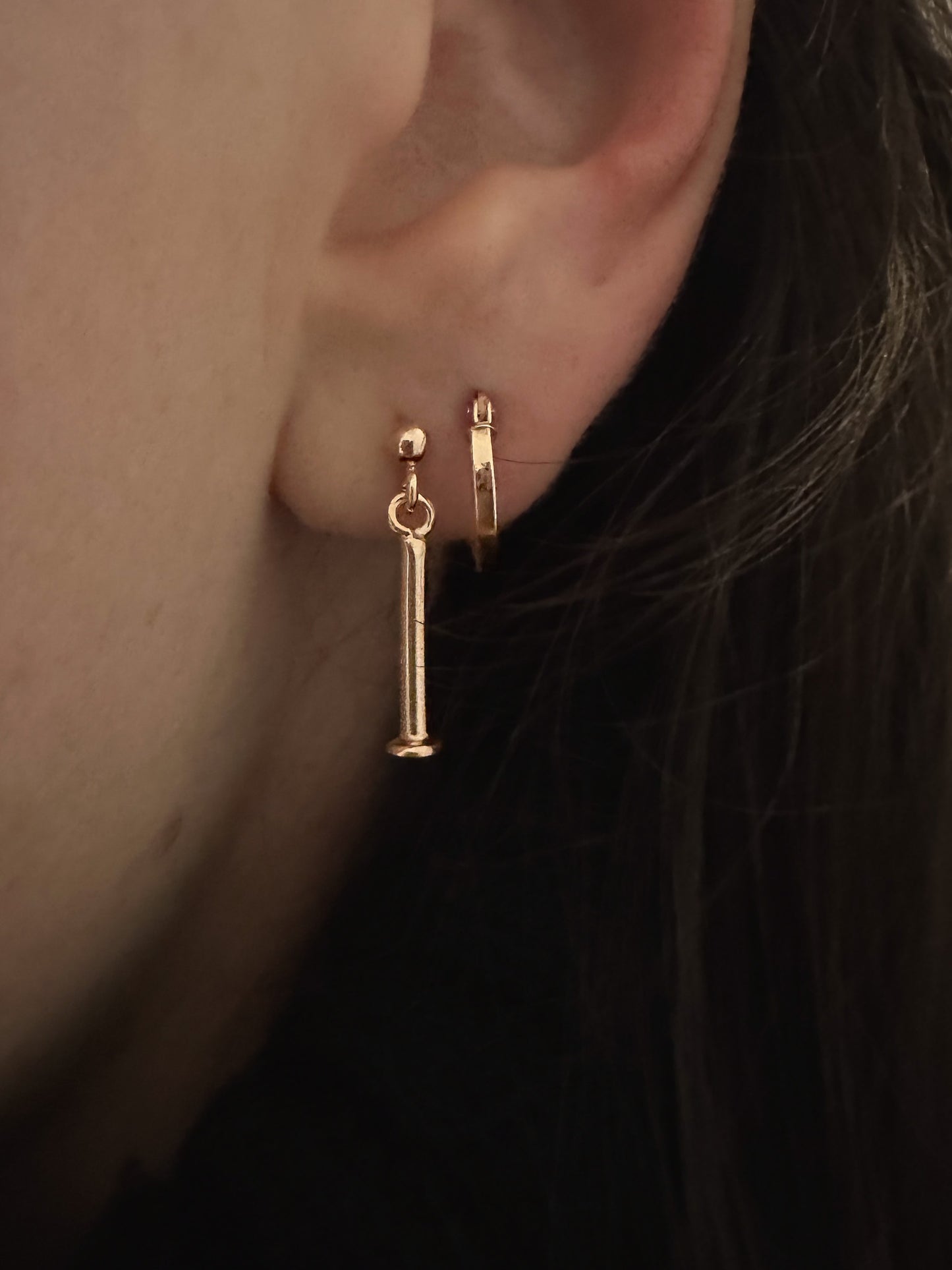 minimalist jewellery. minimalist earring and gold hoop earring. layered earrings.
