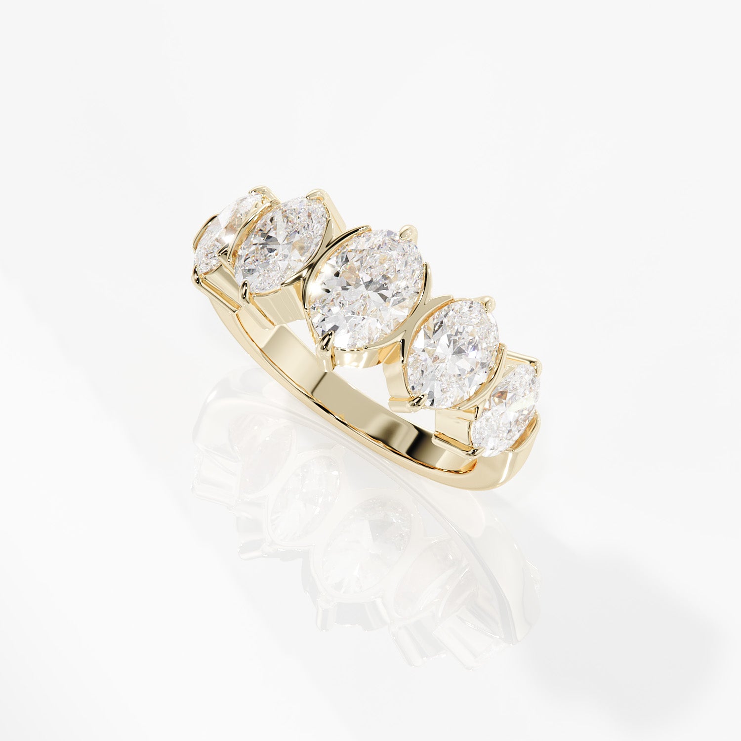Gold ring with three diamonds on a white background