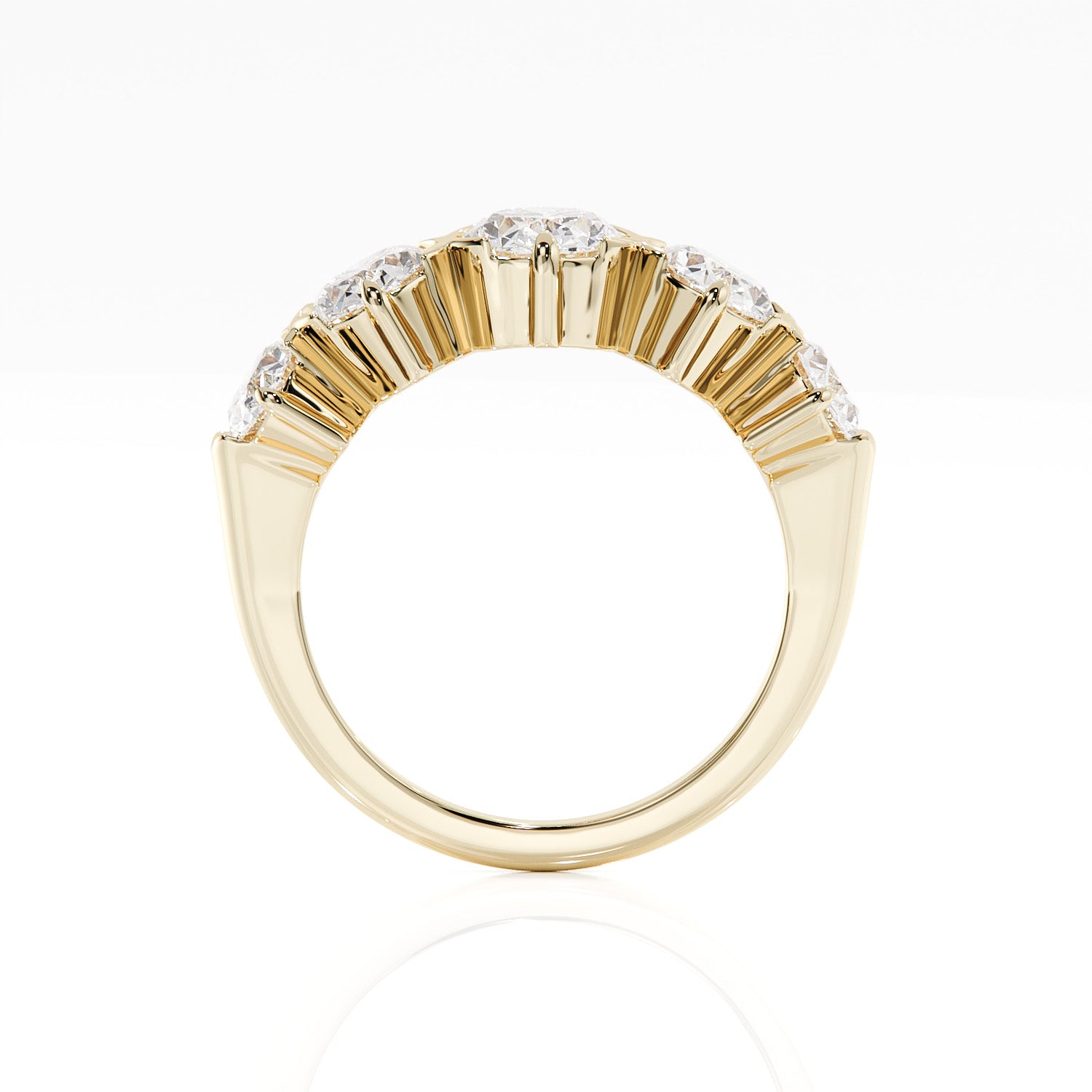 Gold ring with diamond accents on a white background