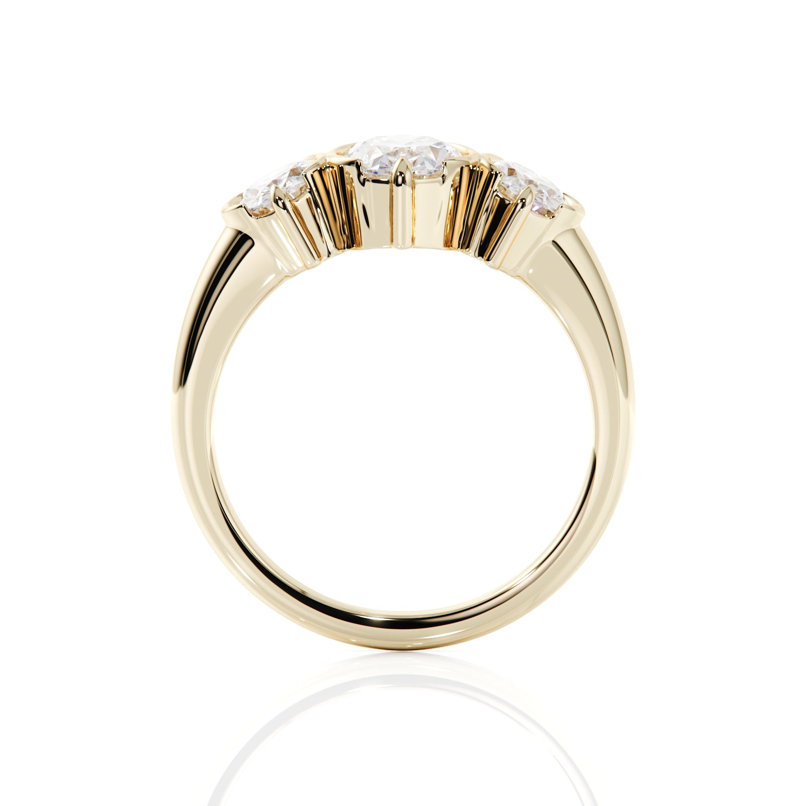 A yellow gold ring with a cluster of small clear gemstones at the top, shown on a clean white background with a soft reflection below.