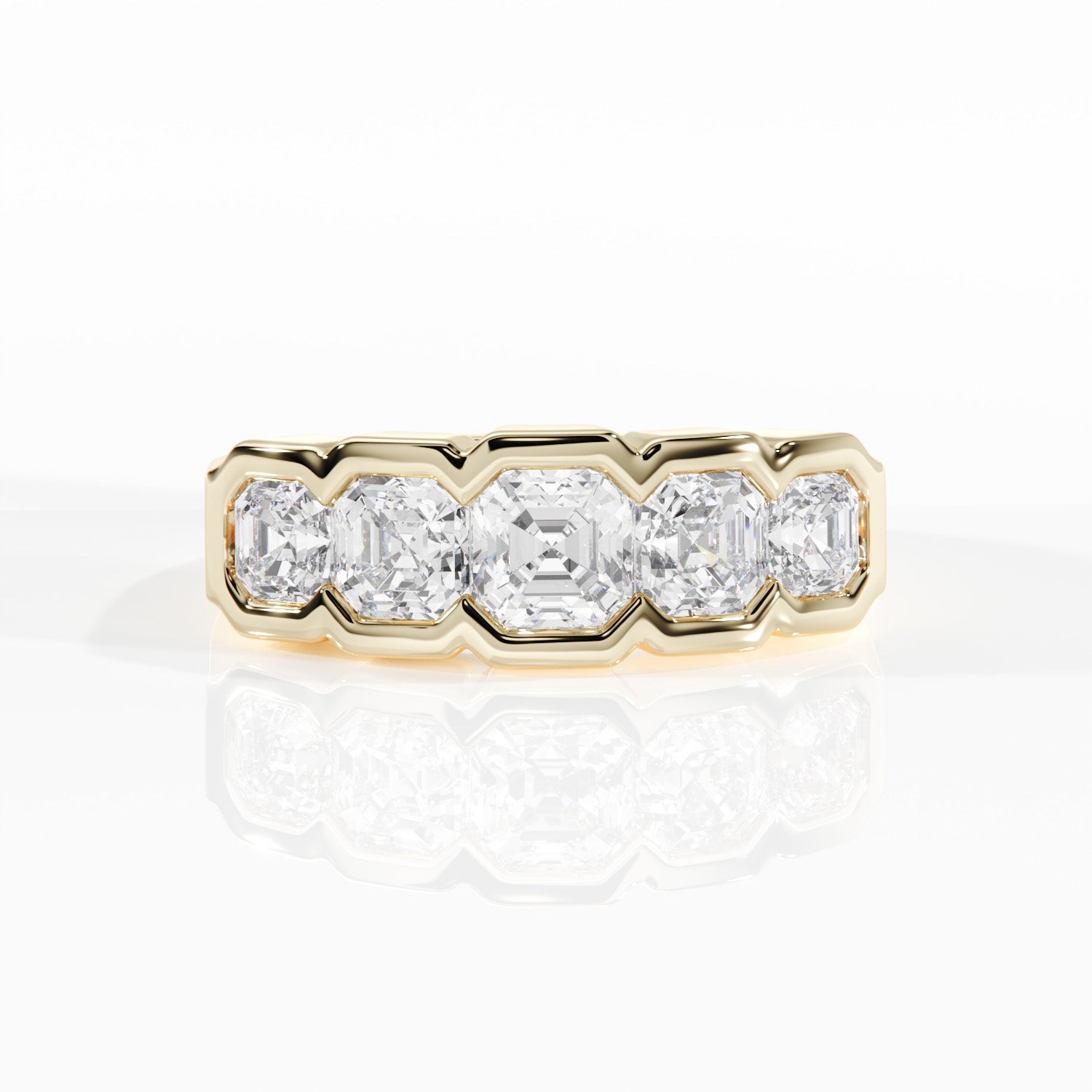 Gold ring with five diamonds on a white background