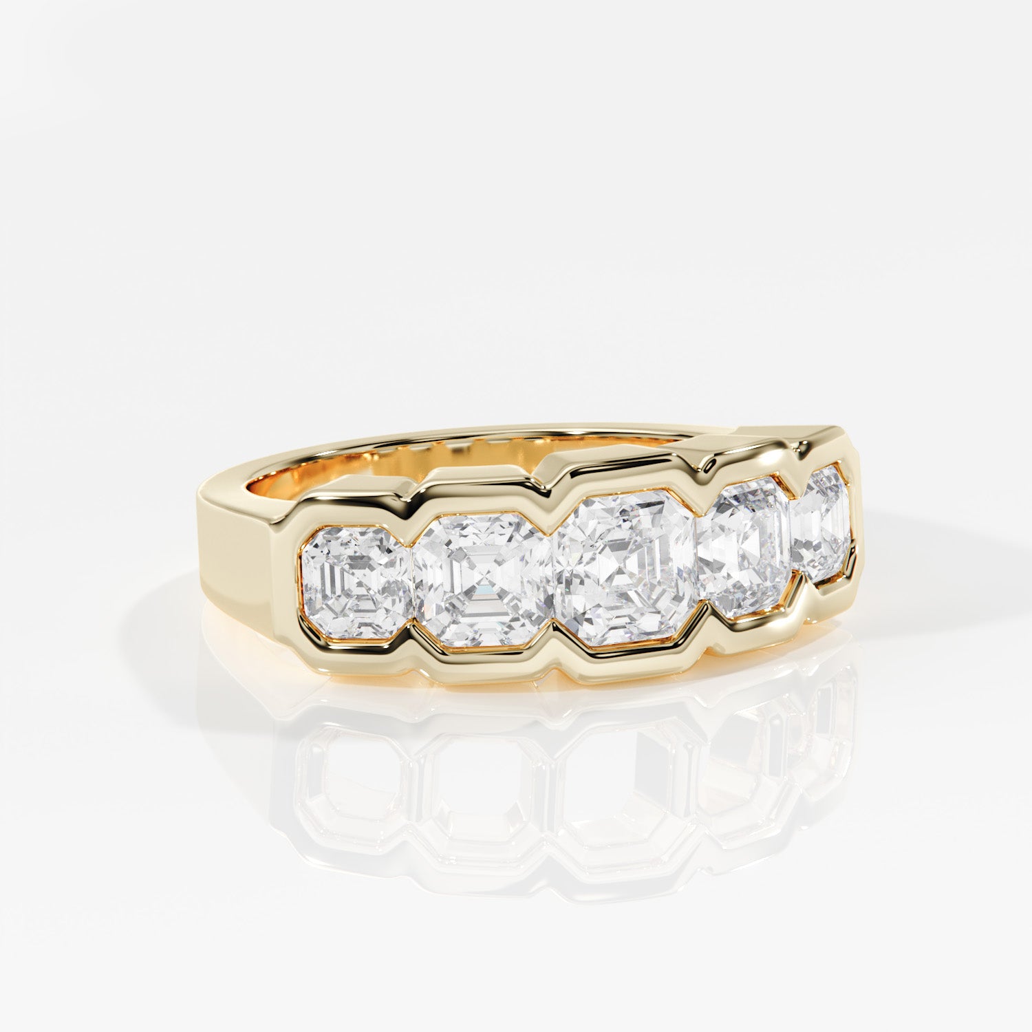 Gold ring with four diamonds on a white background