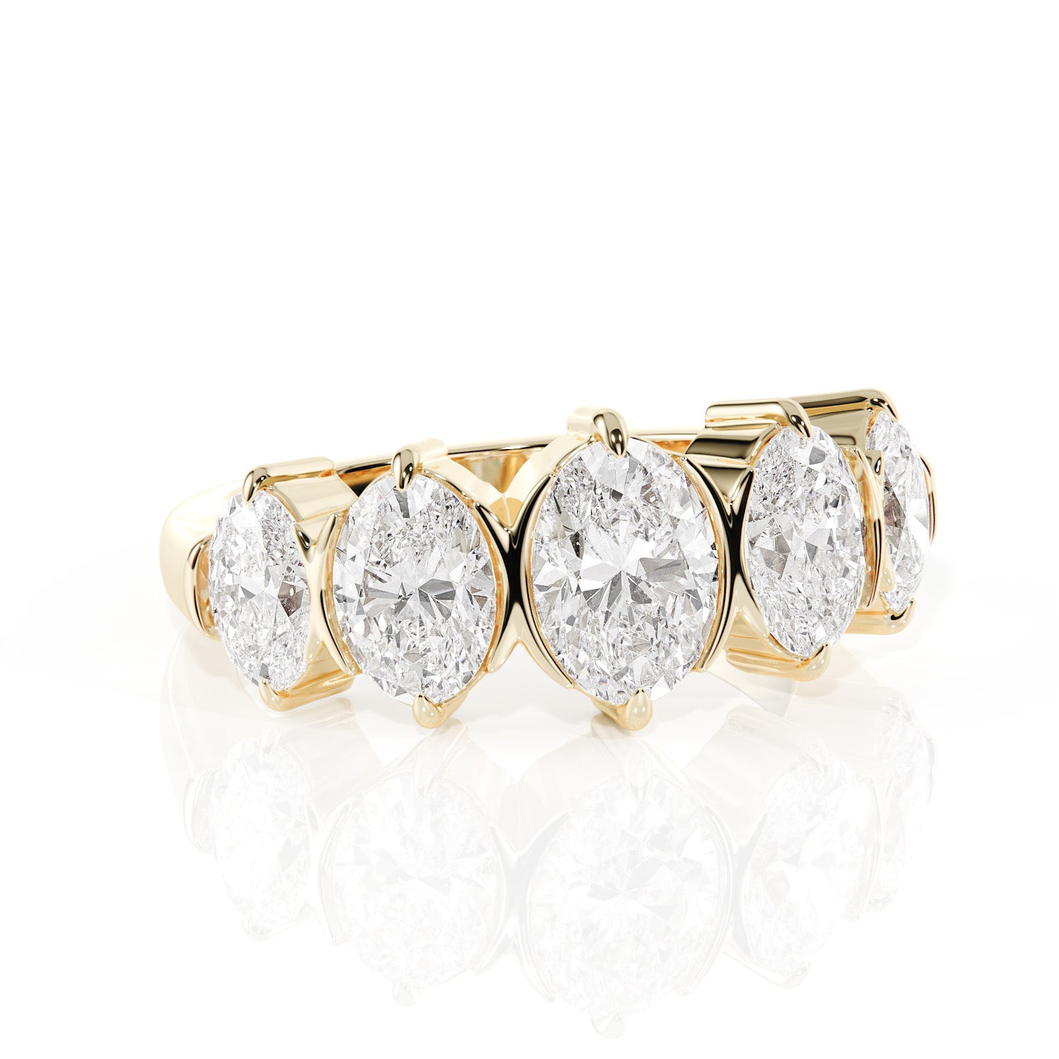 Gold ring with oval-shaped diamonds on a white background