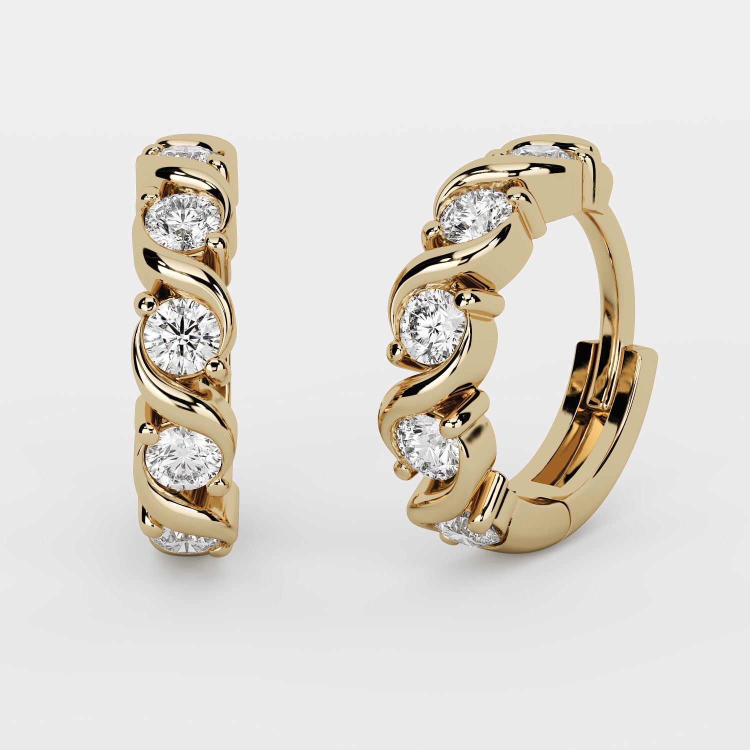 A pair of gold huggie hoop earrings with a twisted design and round-cut clear gemstones, shown on a light gray background.