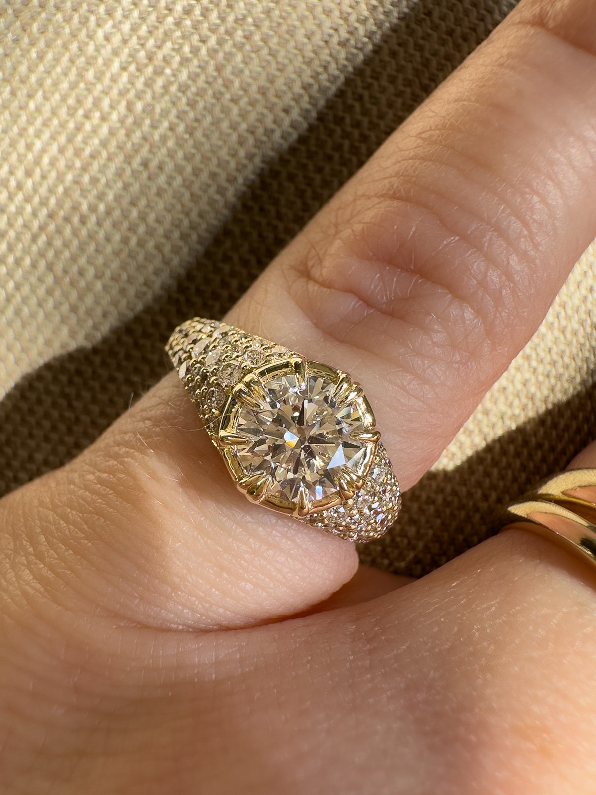 diamond signet ring. round centre diamond in claw setting. Cape Town jewellery. gold ring worn on pinky finger. 