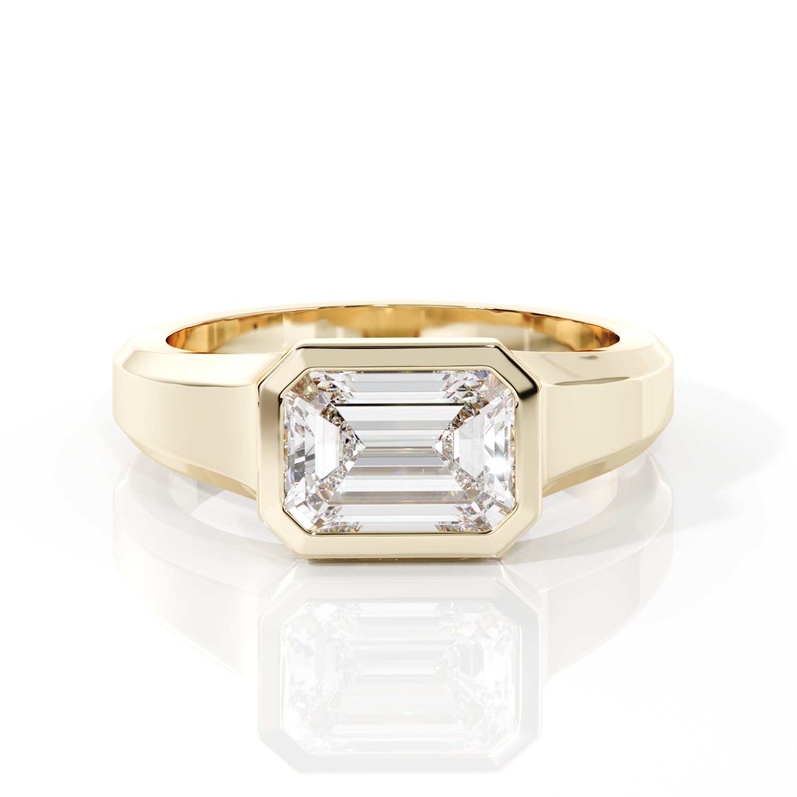 Gold ring with a large diamond on a white background