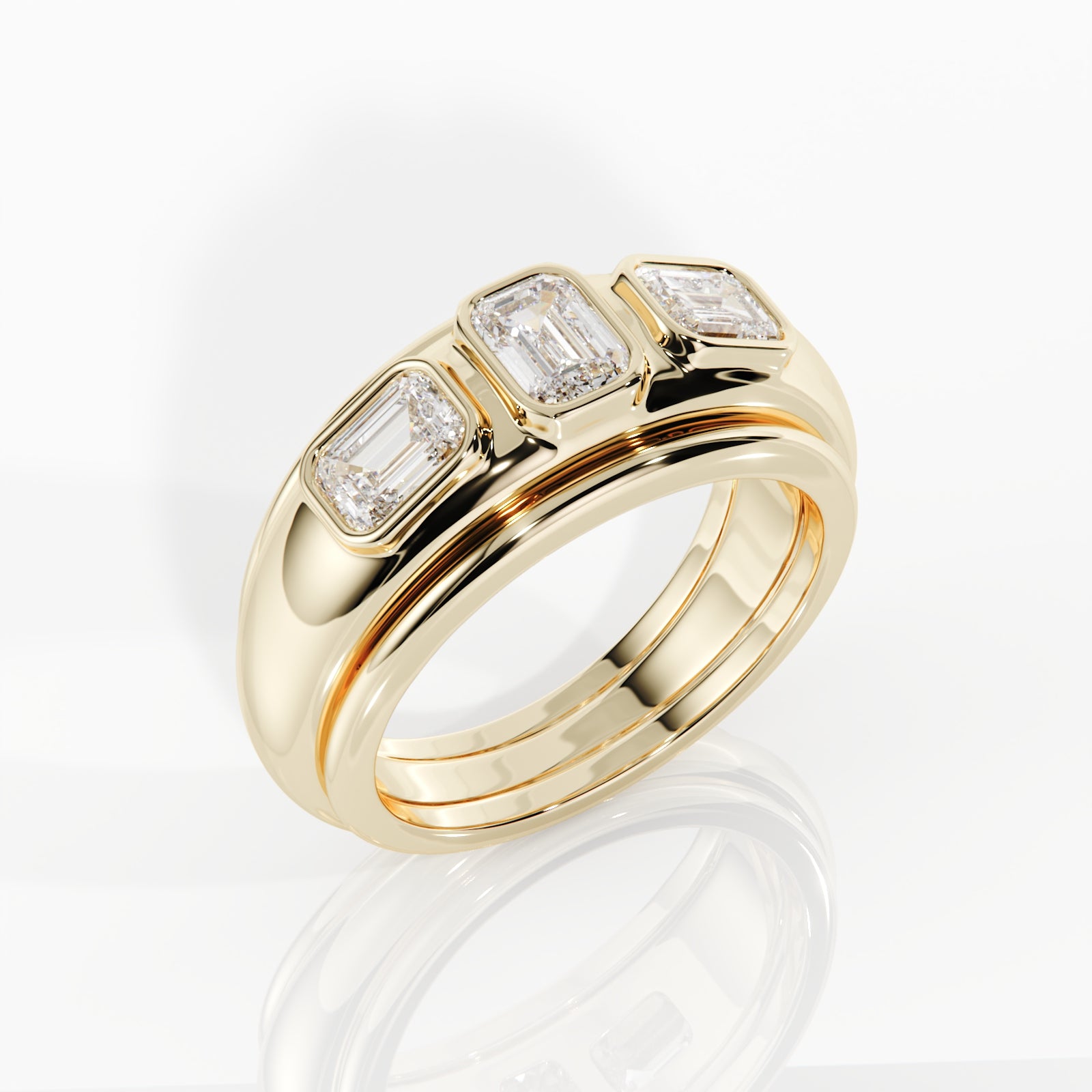 Gold ring with three diamonds on a white background