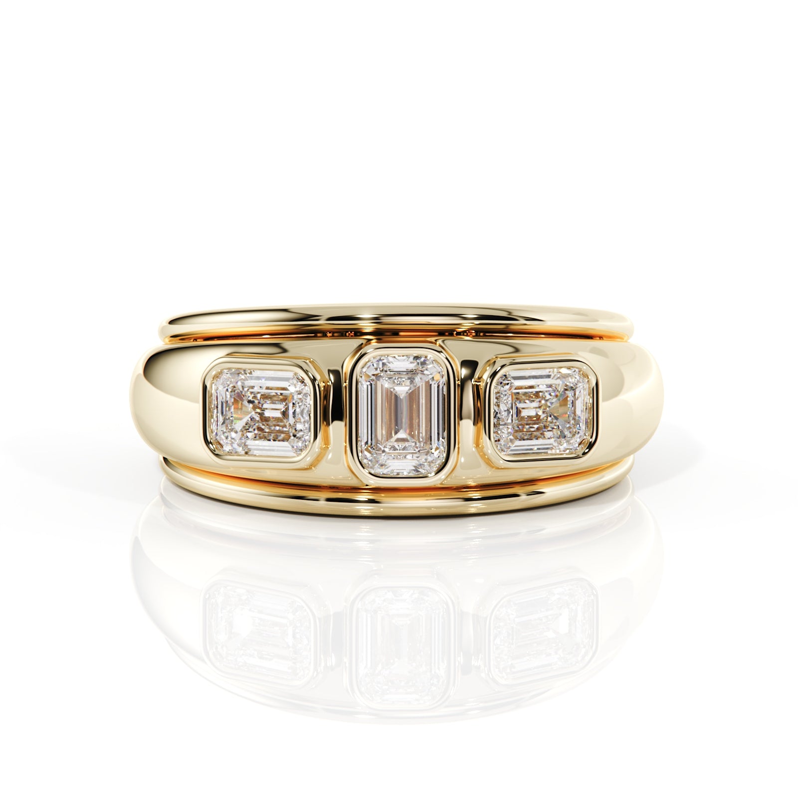 Gold ring with three emerald-cut diamonds on a white background