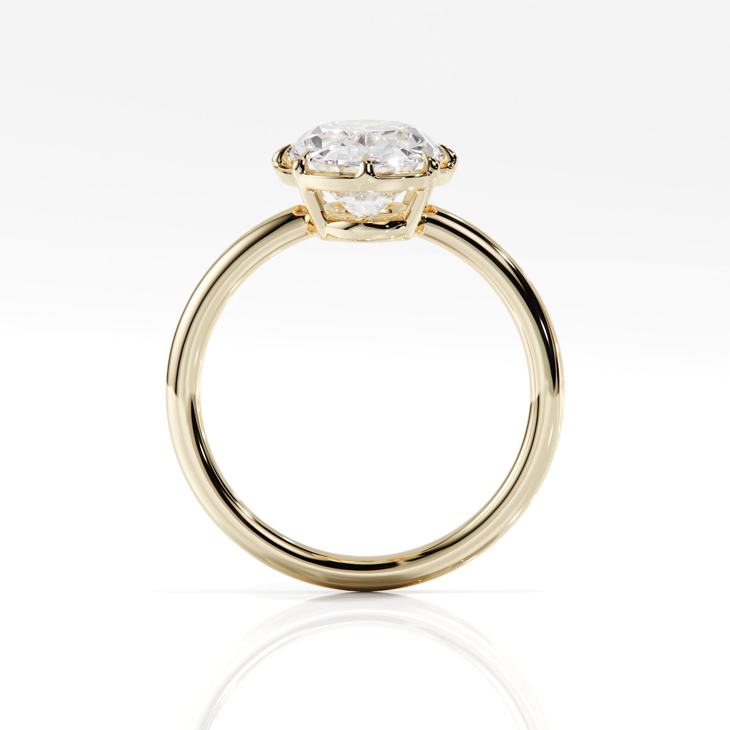 Gold ring with a diamond on a white background
