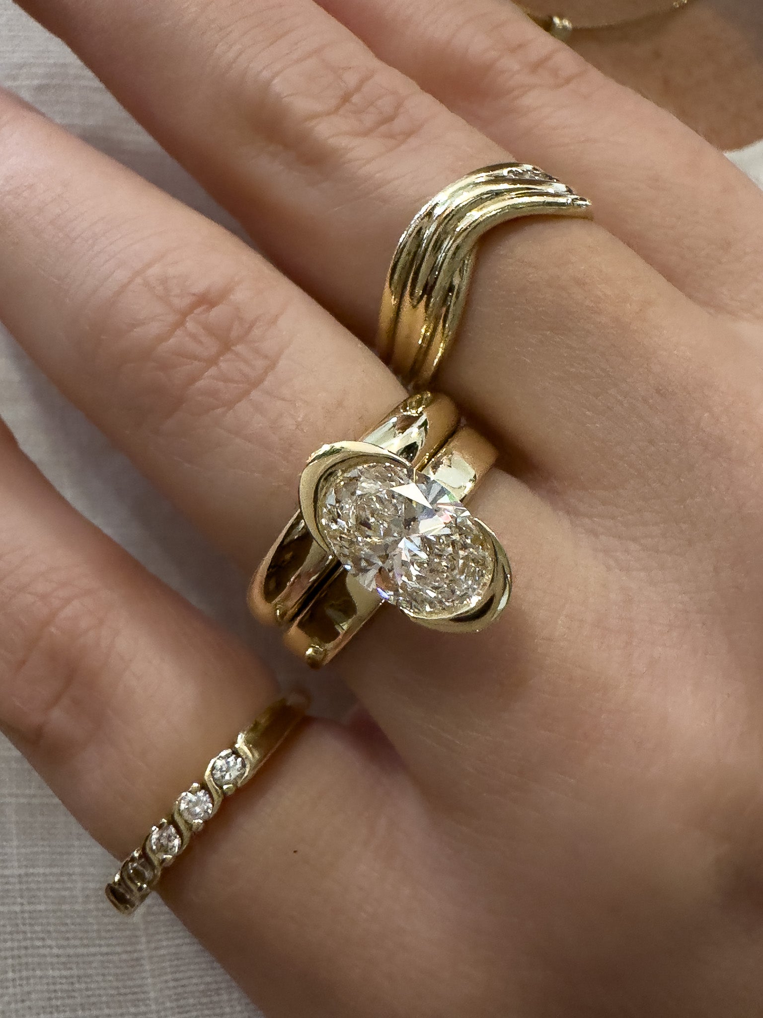 Gold ring with a diamond on a hand
