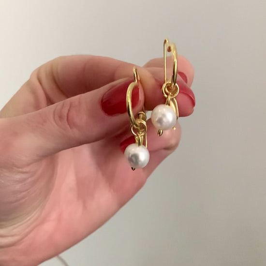  hoop earrings with charms.Sterling Silver: Crafted from high-quality 925 sterling silver. 8mm A-Grade Round Freshwater Pearl: The centre piece of these hoops, adding an element of timeless elegance.